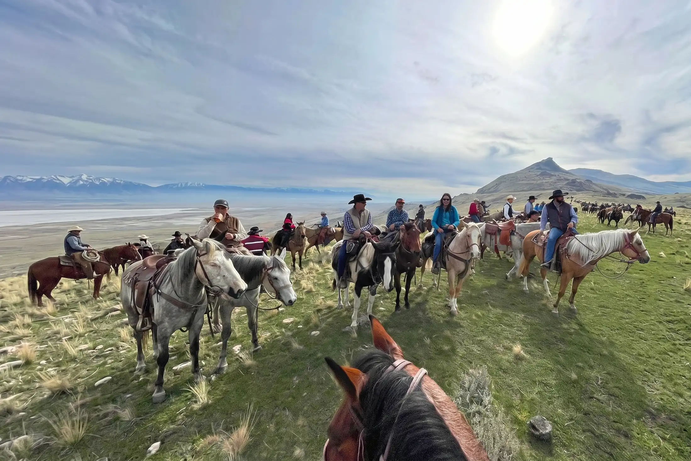 People on horses at the buffalo roundup at Antelope Island