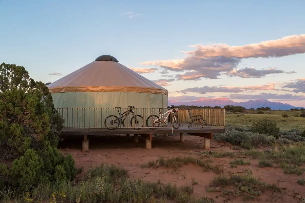 A view of the Moenkopi Yurts and mountain bikes parked outside on the deck, Dead Horse Point State Park